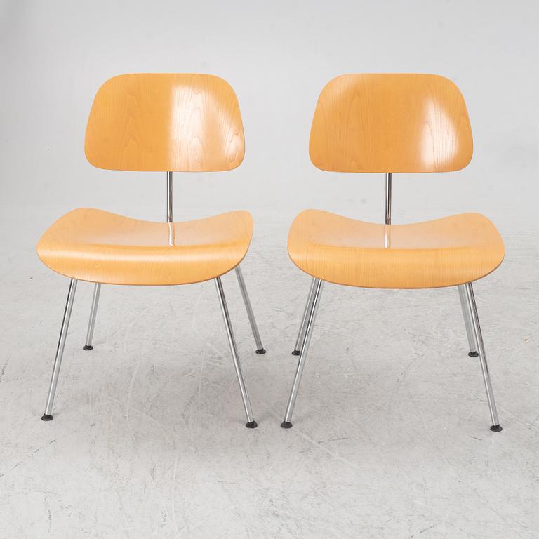 Charles & Ray Eames, a set of four 'DCM' chairs, Vitra, dated 2002.