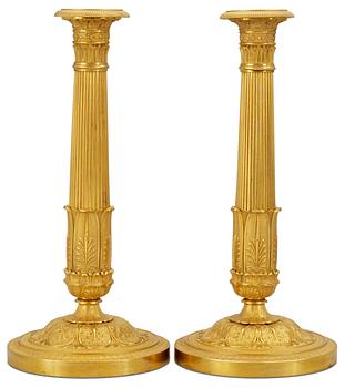 1046. A pair of Empire candlesticks.