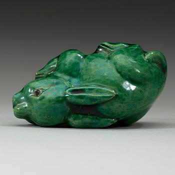A green glazed figurine, Qing dynasty (1644-1912).