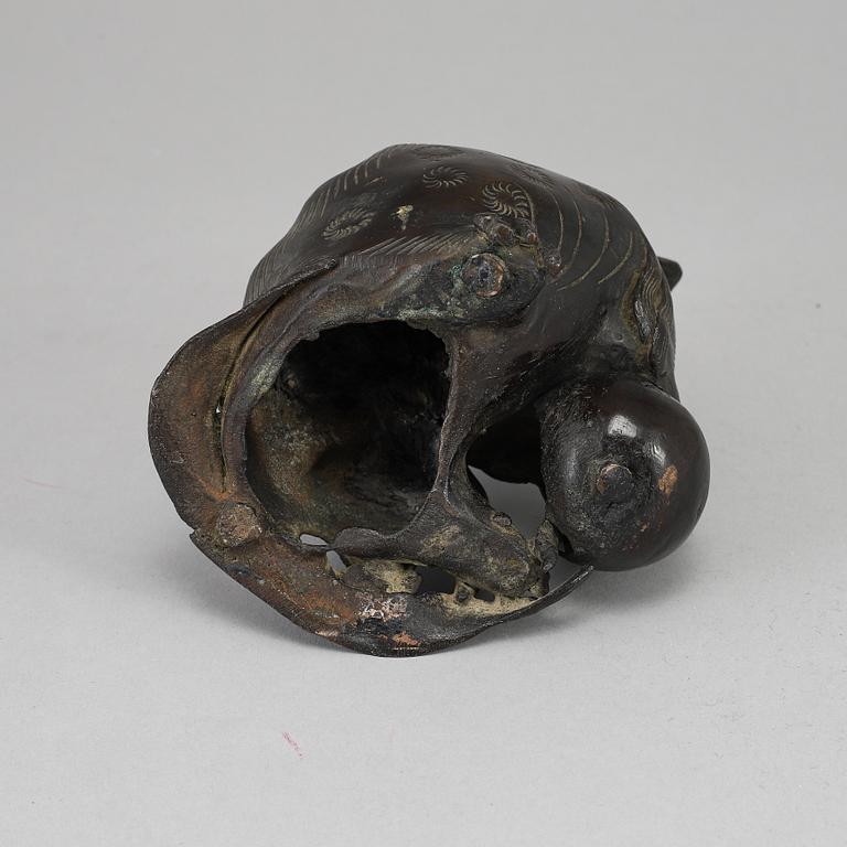 A bronze figure of a buddhist lion, Qing dynasty, circa 1900.