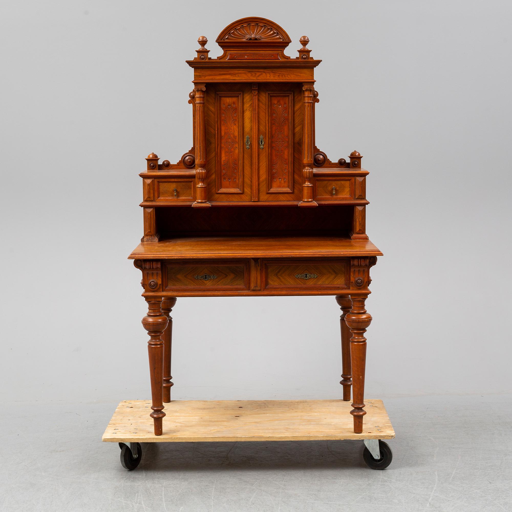 A late 19th century walnut veneered desk.