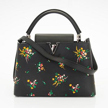 Louis Vuitton, a "Blossom Capucines PM" leather handbag.