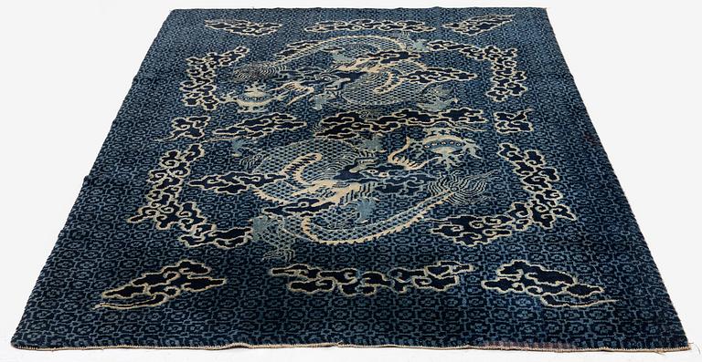A Chinese 'dragon' rug, circa 1920. (c 190x122 cm).