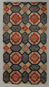 A semiantique Tibetan carpet ca 129 x 67 cm.