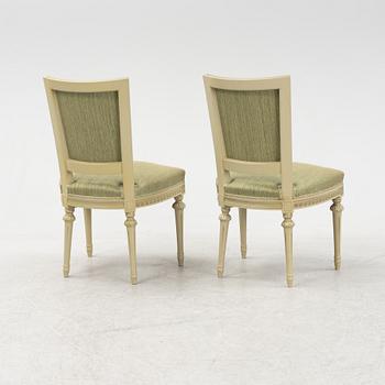 A Gustavian dining table with six chairs. Åmells dated 1974.