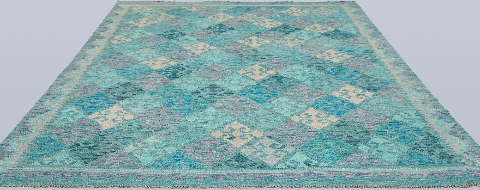 A Kelim carpet, c. 291 x 248 cm.