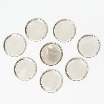 Eight coasters, silver 900, 20th century.