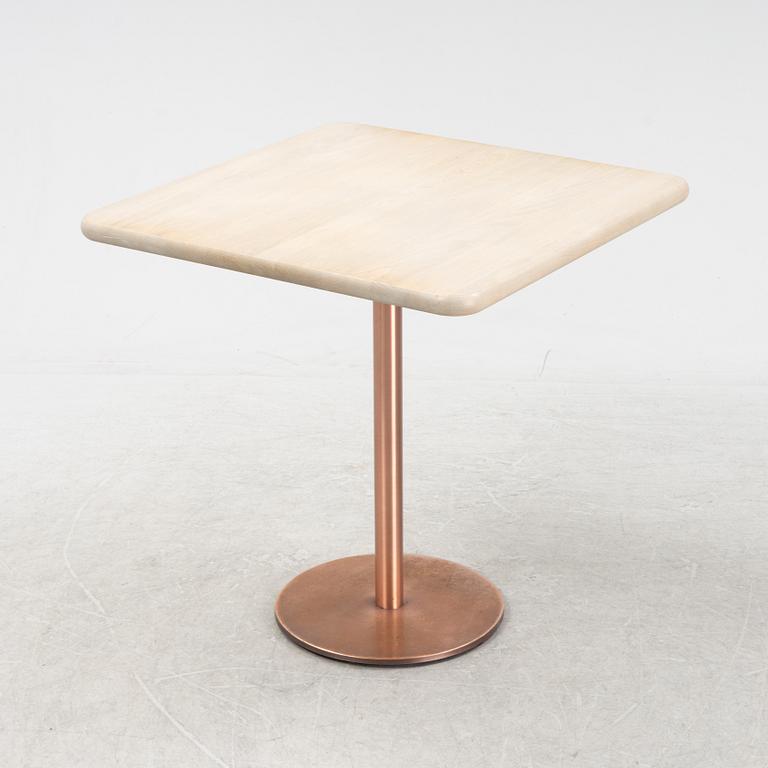 A steel and oak table by Jonas Lindvall 2011.