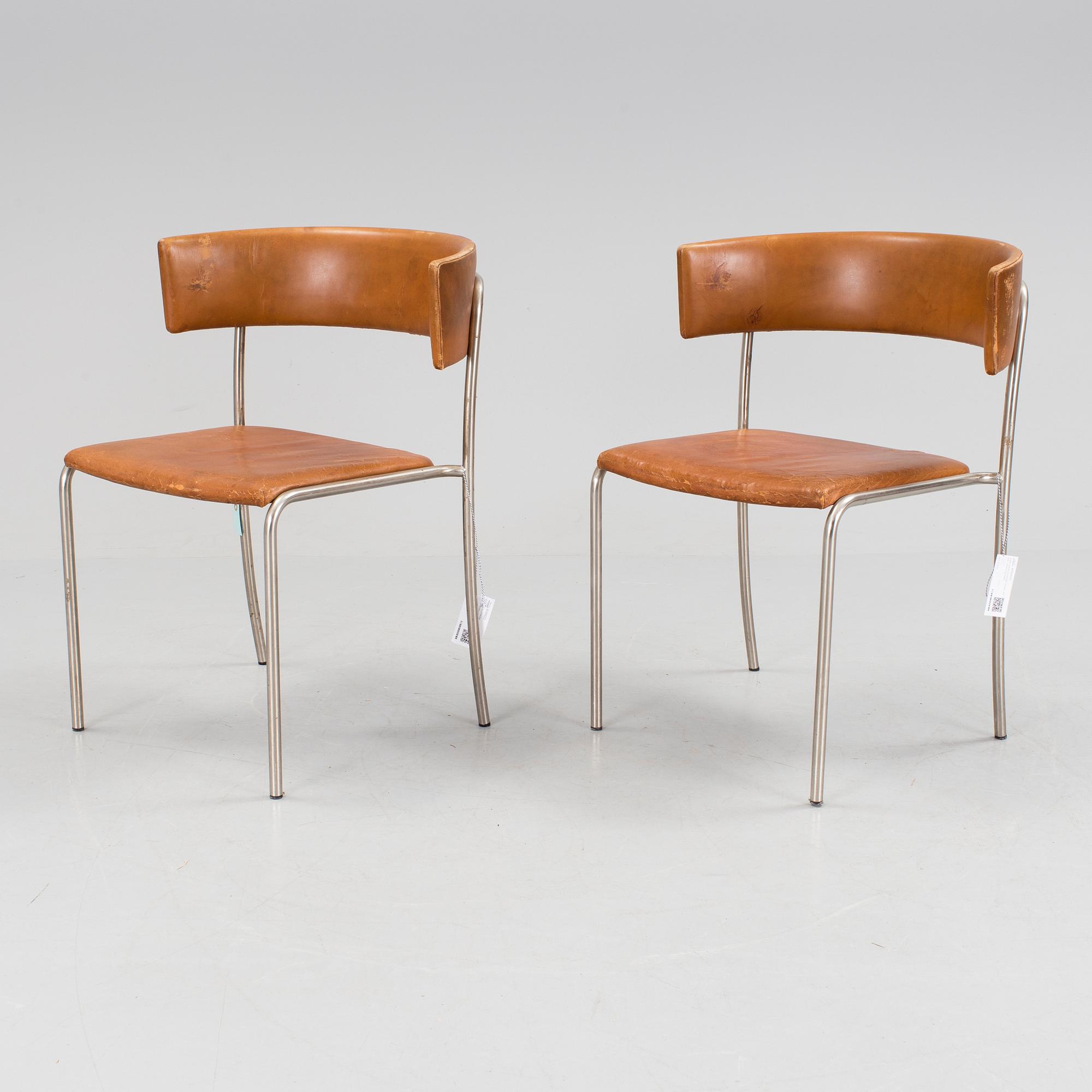 A pair of Erik Karlström leather upholstry chairs, circa 1965.