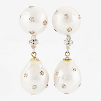 Earrings, a pair, with cultured South Sea pearls and brilliant-cut diamonds.