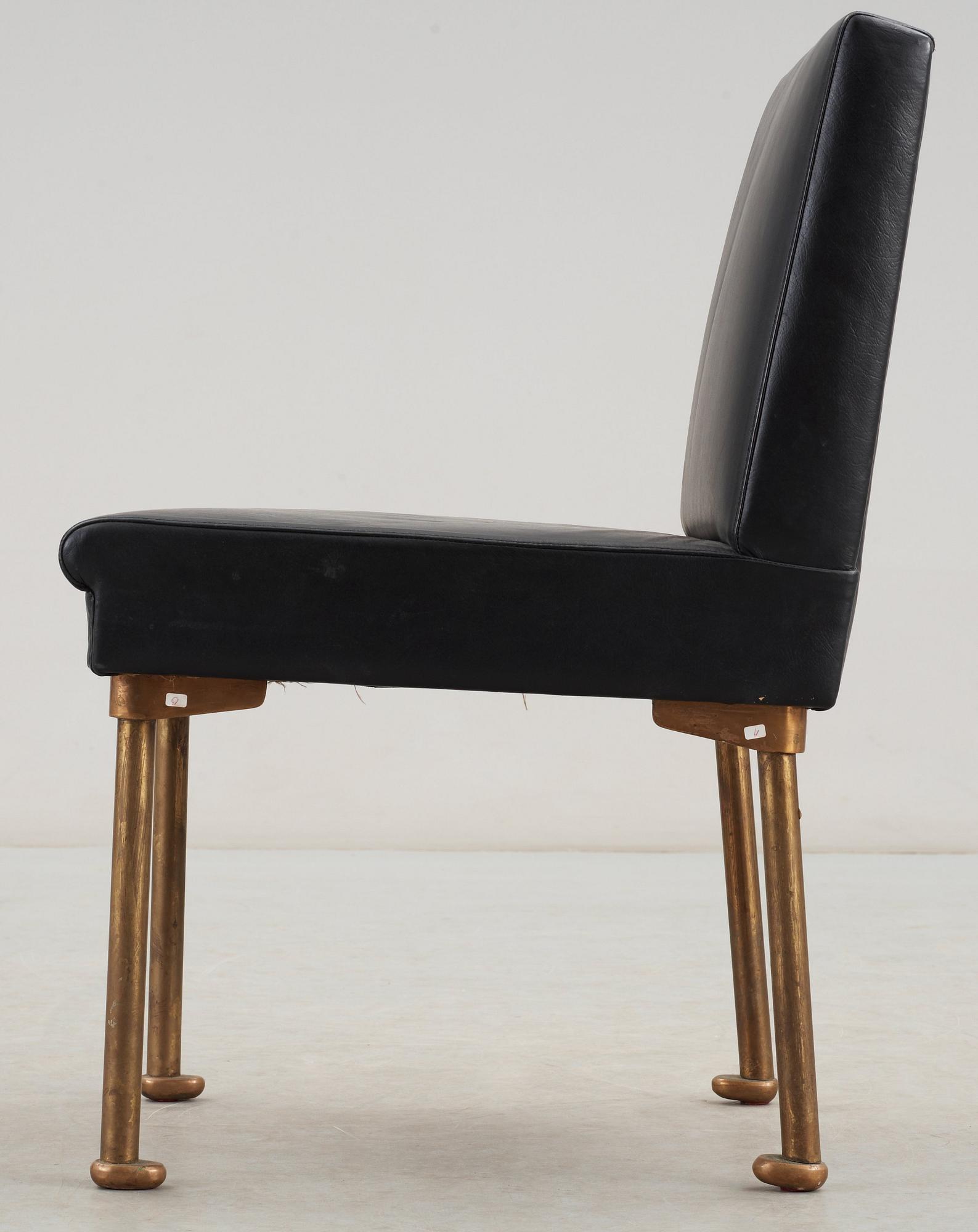 An Alvar Aalto bronze and black leather chair, Artek, Finland 1954.