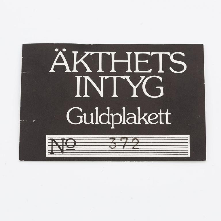 Plaque, 18K gold, numbered 372/1000, 1975, weight approx. 27 g.