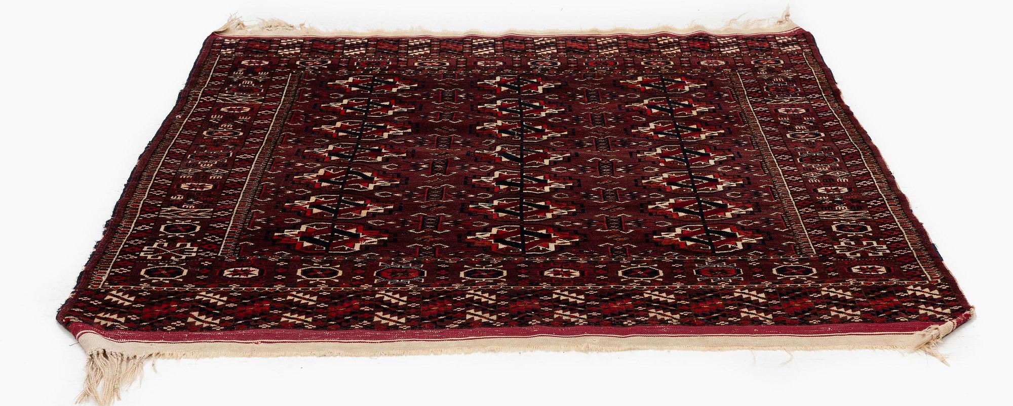 An antique Yomut rug, Western Turkmenistan, c. 119 x 104 cm.