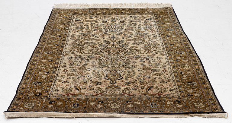 A Ghom, silk rug, c. 215 x 140 cm.