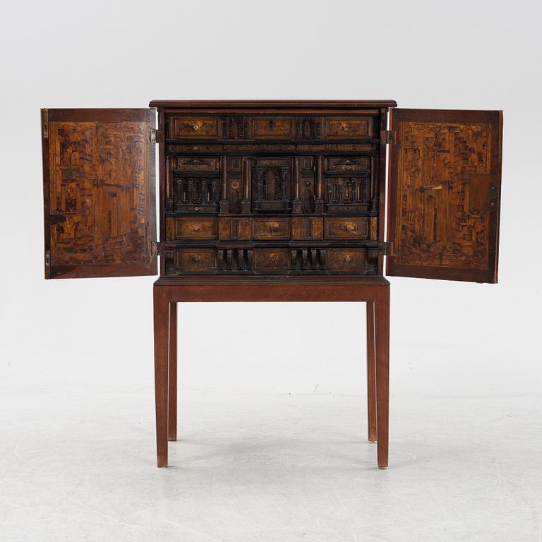 A 19th Century mahognay cabinet with older parts.