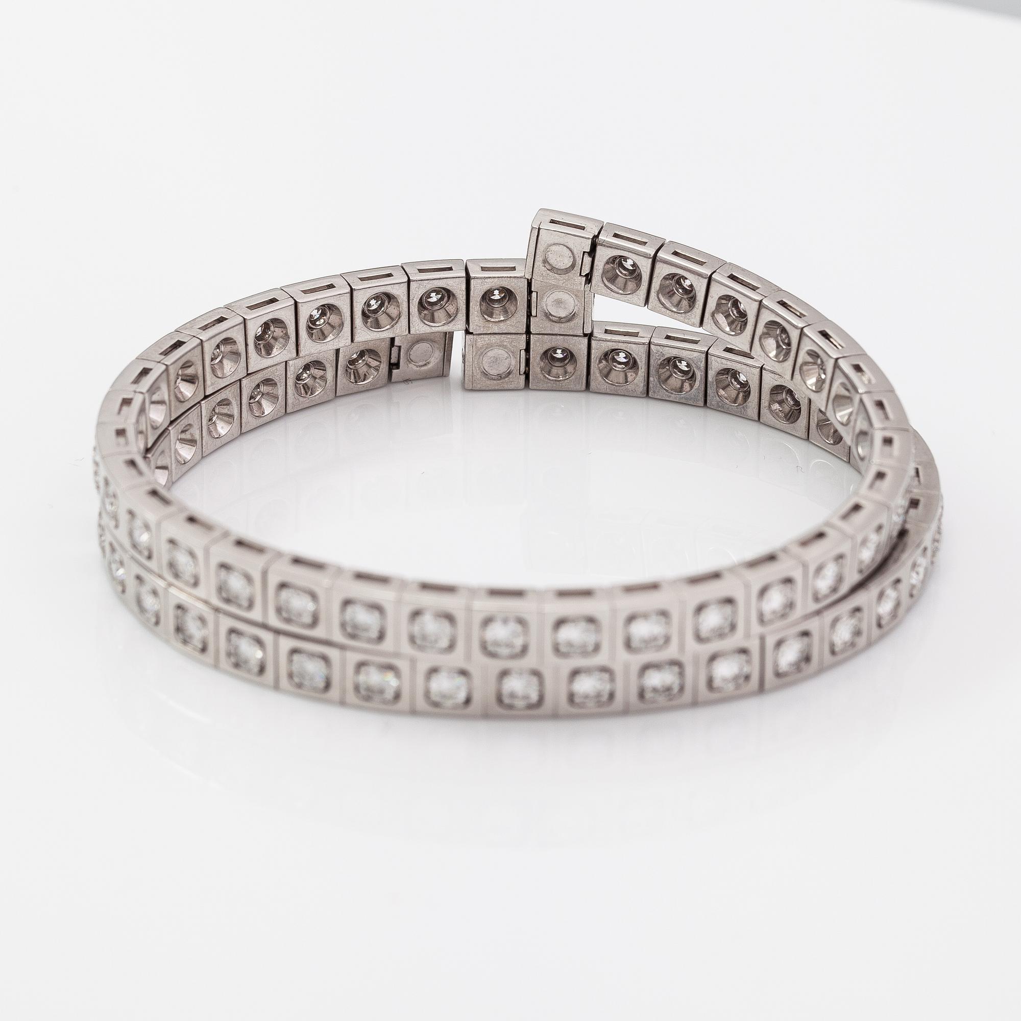 Cartier, Rannekoru "Tectonique", 18K valkokultaa, briljanttihiottuja timantteja n. 11.90 ct yht. Merkitty CT6808, JC.