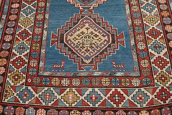 A RUNNER, a semi-antique Caucasian, ca 303,5 x 129,5-140,5 cm (as well as one end with 2,5 cm flat weave).