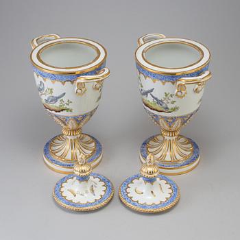 A pair of French 19th century porcelaine 
lidded vases with Sèvres style mark.