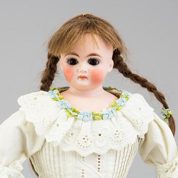 a German porcelain doll from the early 20th century.