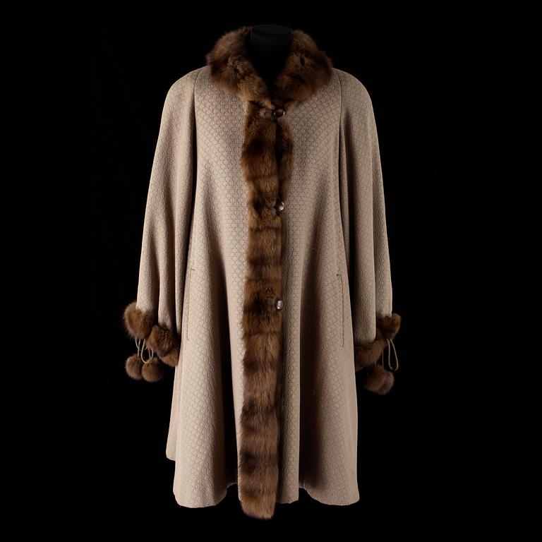 A 1980s fur-trimmed beige silk and wool cape by Louis Féraud.
