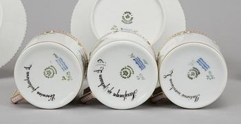 A set of three plus one porcelain "Flora Danica" coffee cups and saucers, "Royal Copenhagen, Denmark.