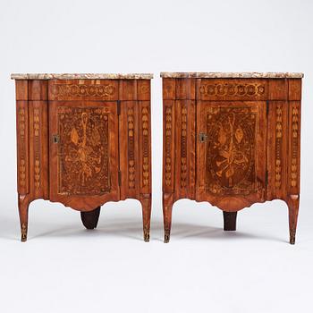 A pair of Louis XVI corner cupboards by Francois Gaspard Teunè (master in Paris from 1766), 18th century.