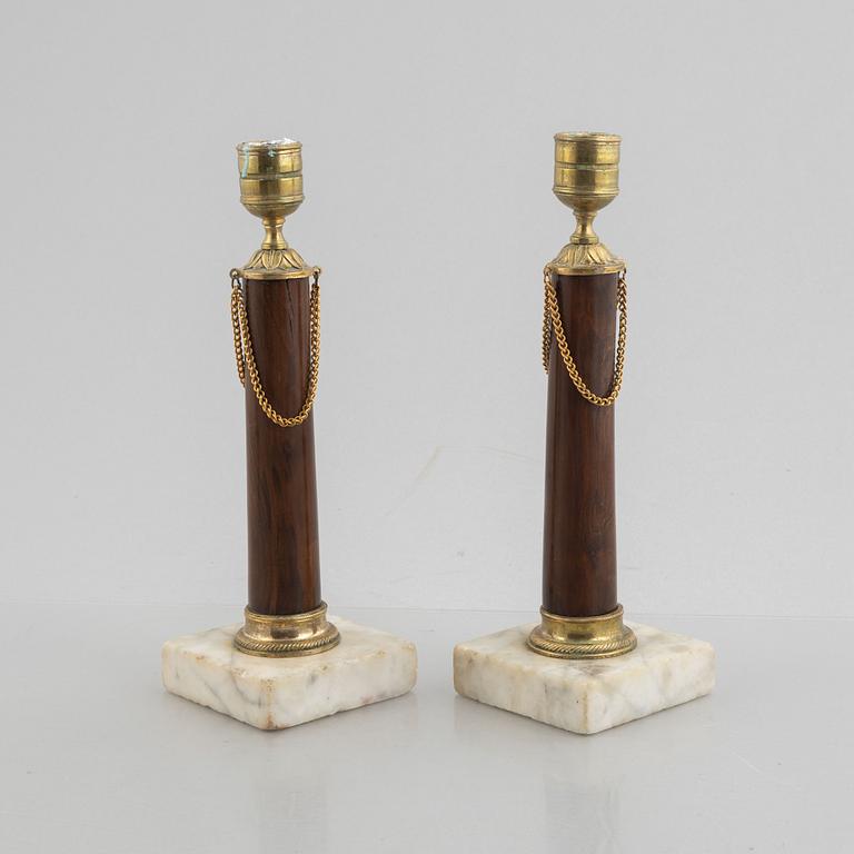 A pair of late Gustavian gilt brass, marble and birch candlesticks, circa 1800.