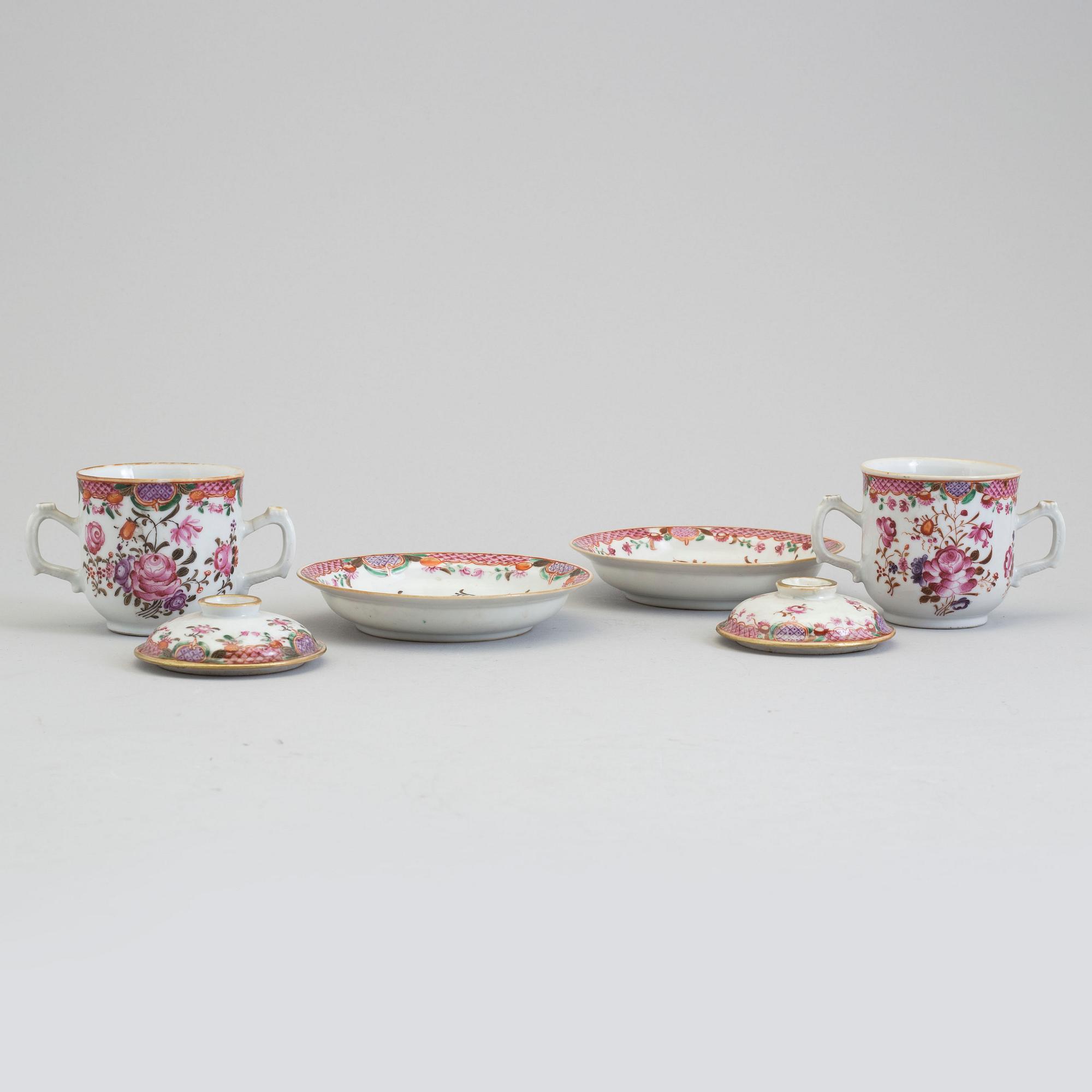 A pair of famille rose cups with covers and stands, Qing dynasty, Qianlong (1736-95).