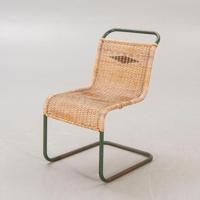 A 1930s braided rattan and metal chair.