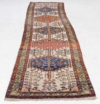 An oriental runner, c. 395 x 82 cm.