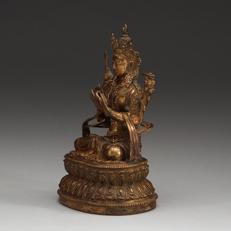 A gilt bronze and jeweled figure of Manjusri, with Yongle six character mark.