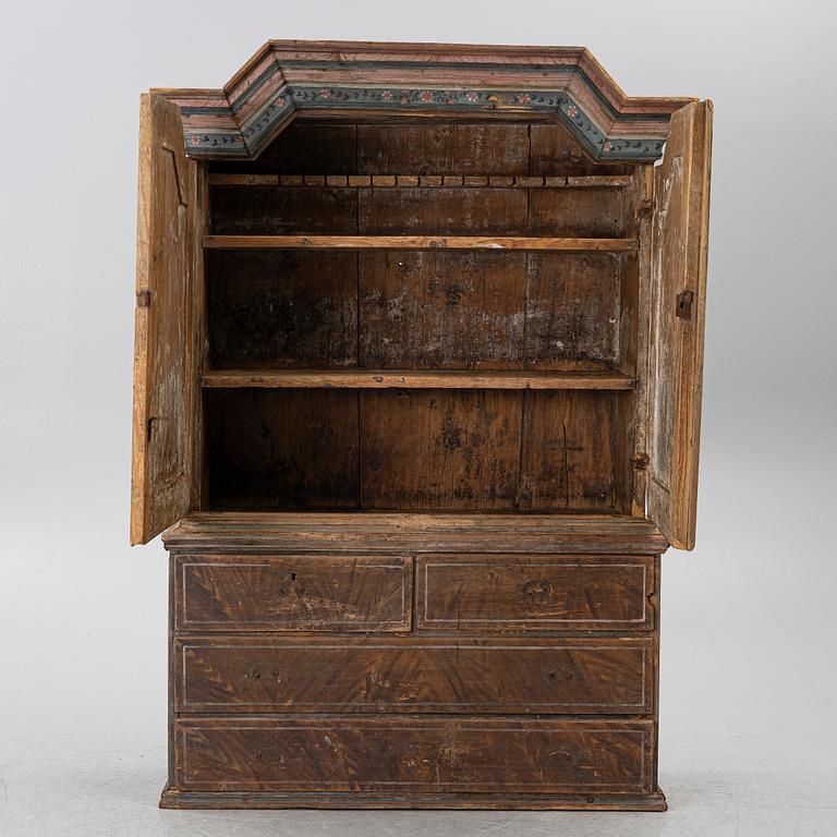 A folk-art cabinet attributed to  "Gammelmålaren" Anders Nilsson (Brunskog, 1807–1889).