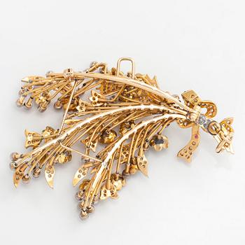 A 17K gold brooch/pendant with rose-cut diamonds, cabochon-cut rubies and enamel.