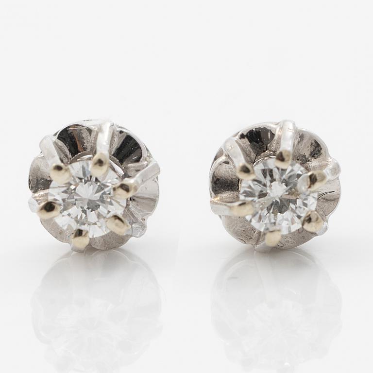 A pair of 18K white gold earrings with round brilliant-cut diamonds.