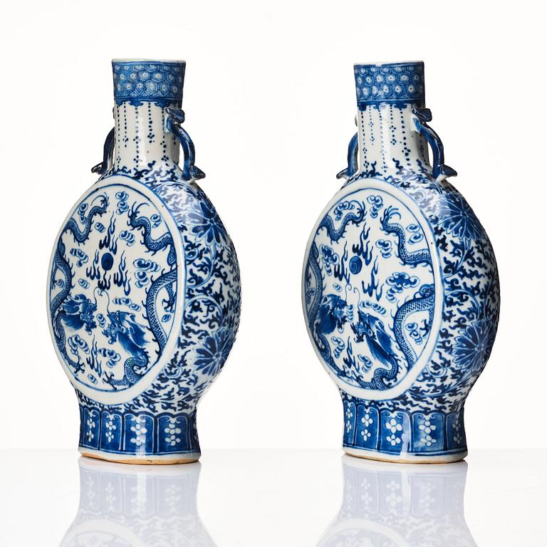 A pair of Chinese blue and white pilgrim vases, Qing dynasty, 19th Century.