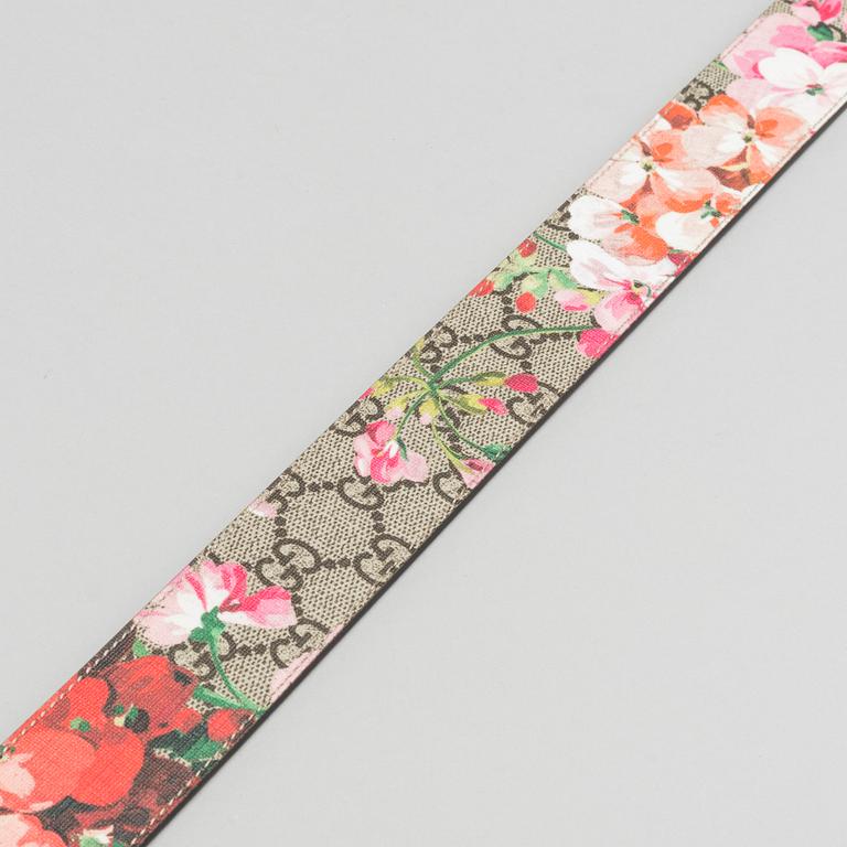 A Gucci blooms belt.