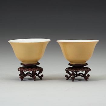 A pair of Imperial yellow bowls, Qing dynasty, Yongzheng six-character mark and of the period (1723-1735).