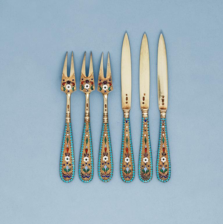 A RUSSIAN SILVER-GILT AND ENAMEL 23 PIECE TABLE-SERVICE, Makers mark of Nicholai Zugeryev, Moscow 1908-1917.