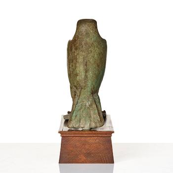 A fine and large Egyptian bronze figure of Horus the falcon, presumably late period Dynasty XXVI, (663-525 B.C.).