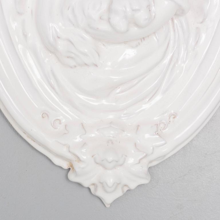 A ceramic wall relief, circa 1900.