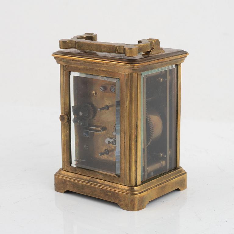 A brass carriage clock, circa 1900.
