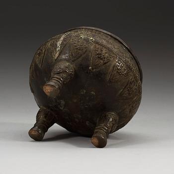 A bronze tripod censer, presumably Ming dynasty.