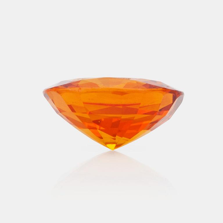 A 7.98 ct yellow-orange sapphire.