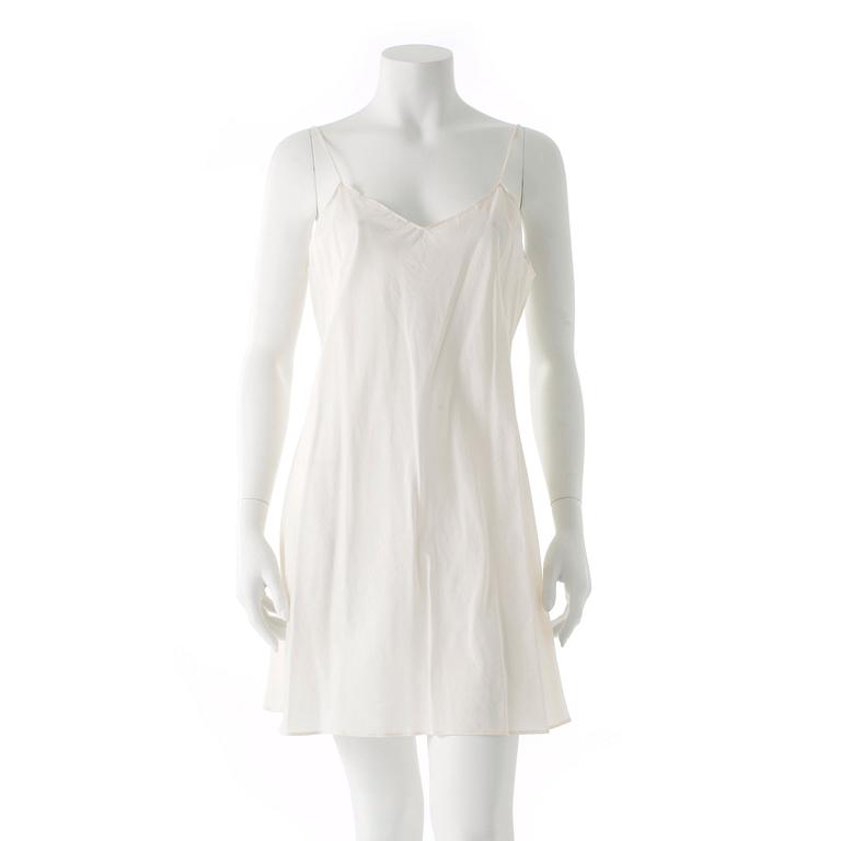 ANNA SUI, a white cotton and embroidered dress.