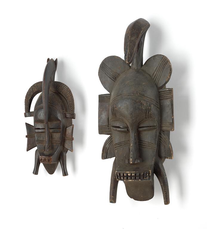 A set of two 20th Century African dance masks.
