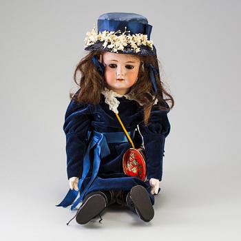 A bisque head doll, Germany, 1910s.