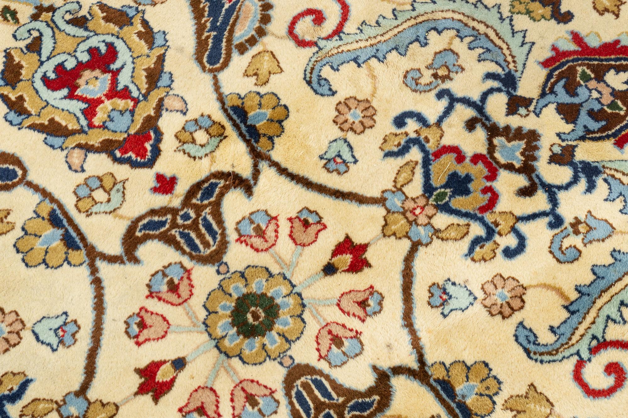 A carpet, signed, circa 286 x 212 cm.