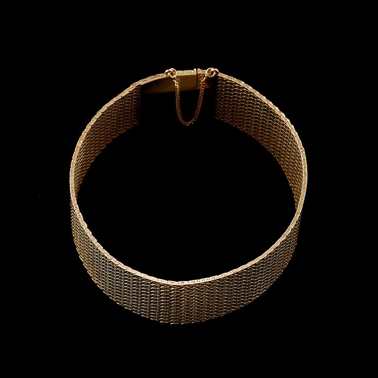 A gold bracelet.