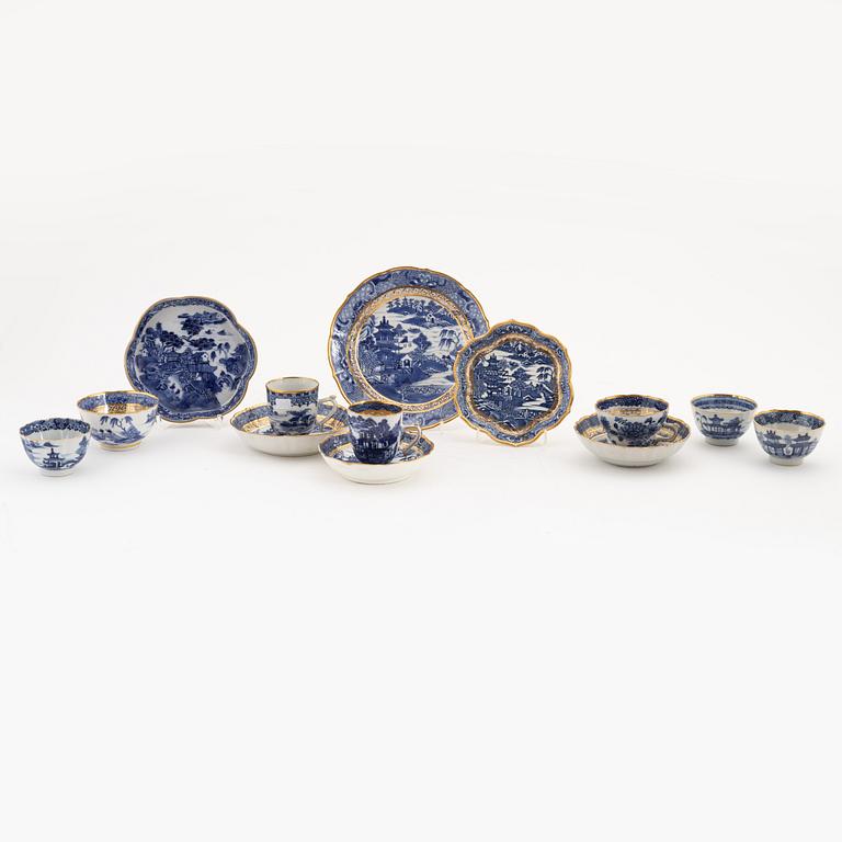 A set of seven gilt and blue and white cups, two saucers, a plate and a dish, Qing dynasty, 18th and 19th century.