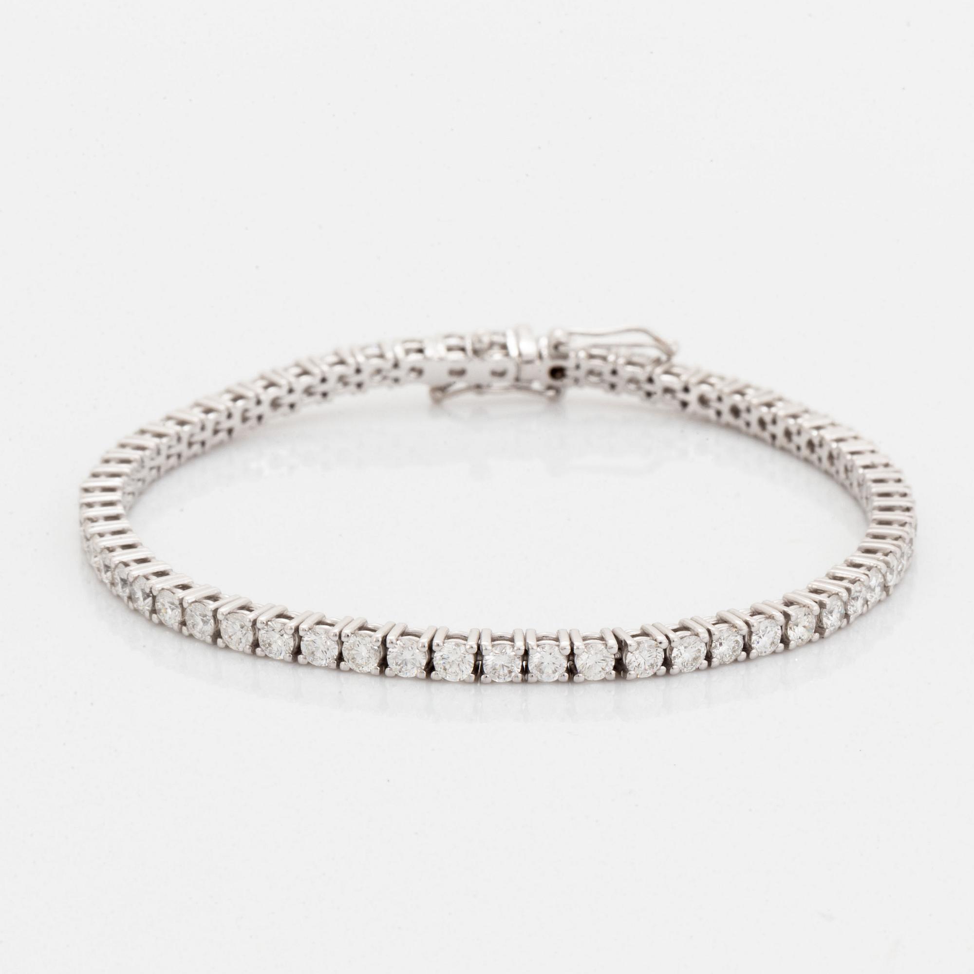 Brilliant-cut diamond tennis bracelet, with report HRD.